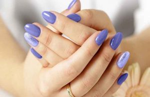 Elegant,Female,Hands,With,Fresh,Violet,Manicure,Lying,On,A
