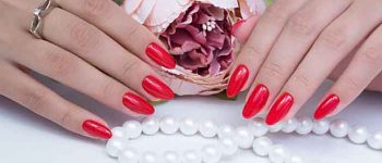 Natural nails with gel polish applied. Ideal manicure and women's hands.